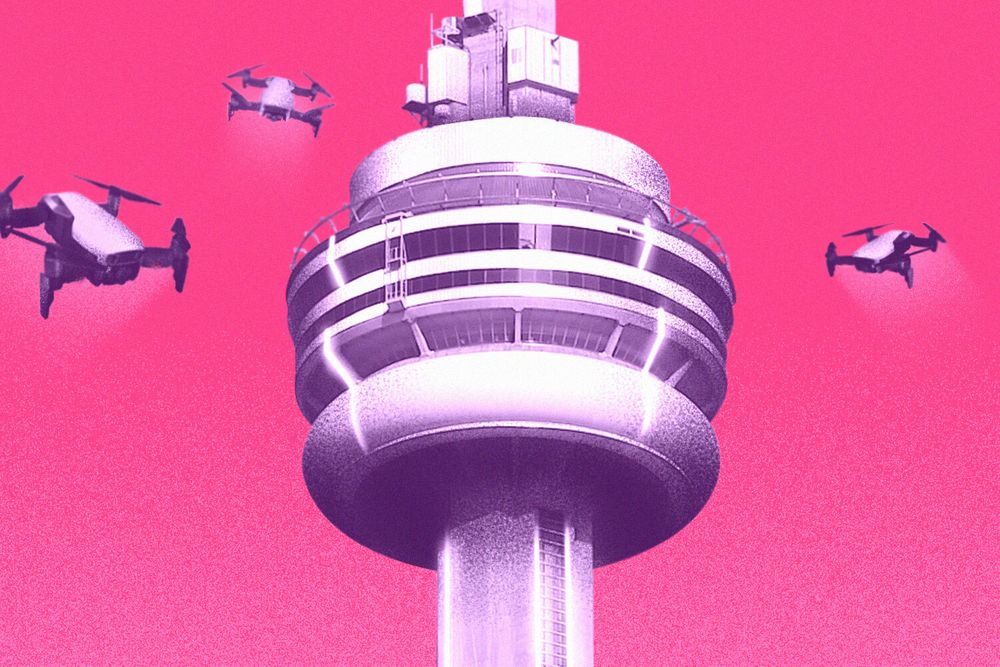 toronto's CN tower with drones hovering around