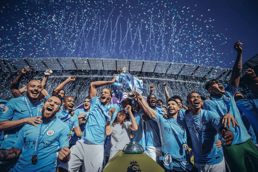 Man City football team celebrate in photograph