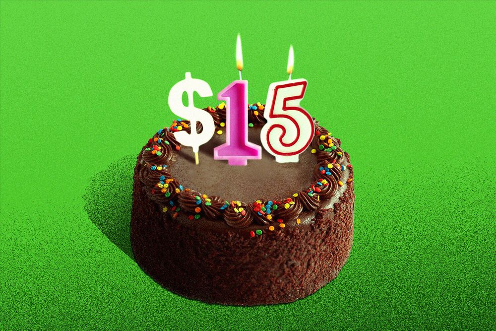 An illustration of a chocolate frosted cake with candles stuck in the top spelling out "$15"