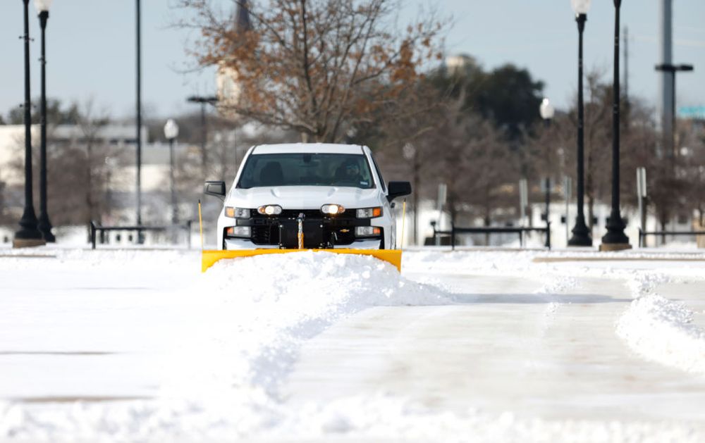 A truck plowing snow 