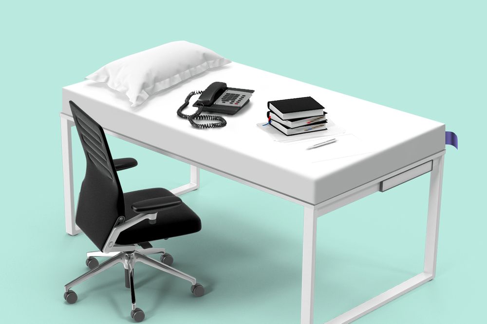 An illustration of a black chair at a white office desk in front of a teal background; on the desk is a phone, stack of notebooks, and pillow.
