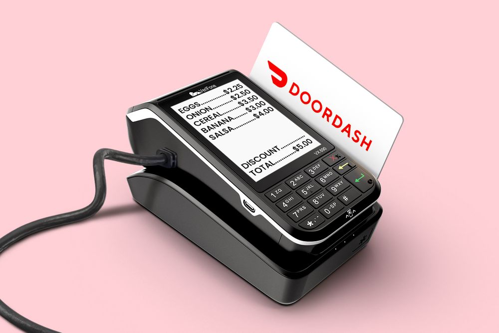DoorDash credit card being swiped in card swiper