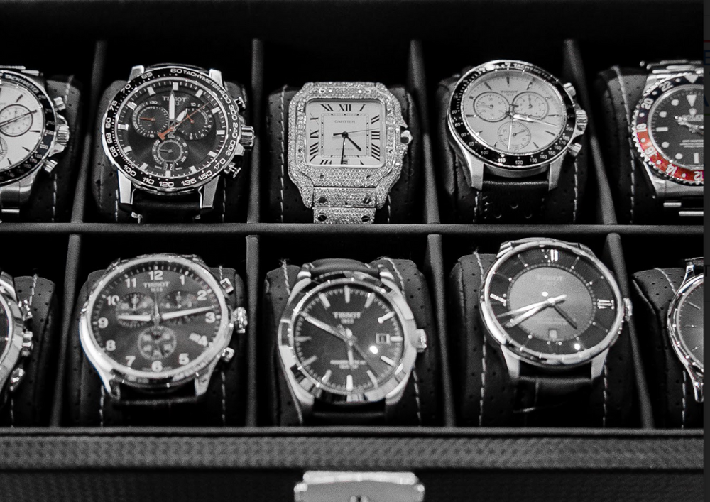 Luxury watches in a black leather case
