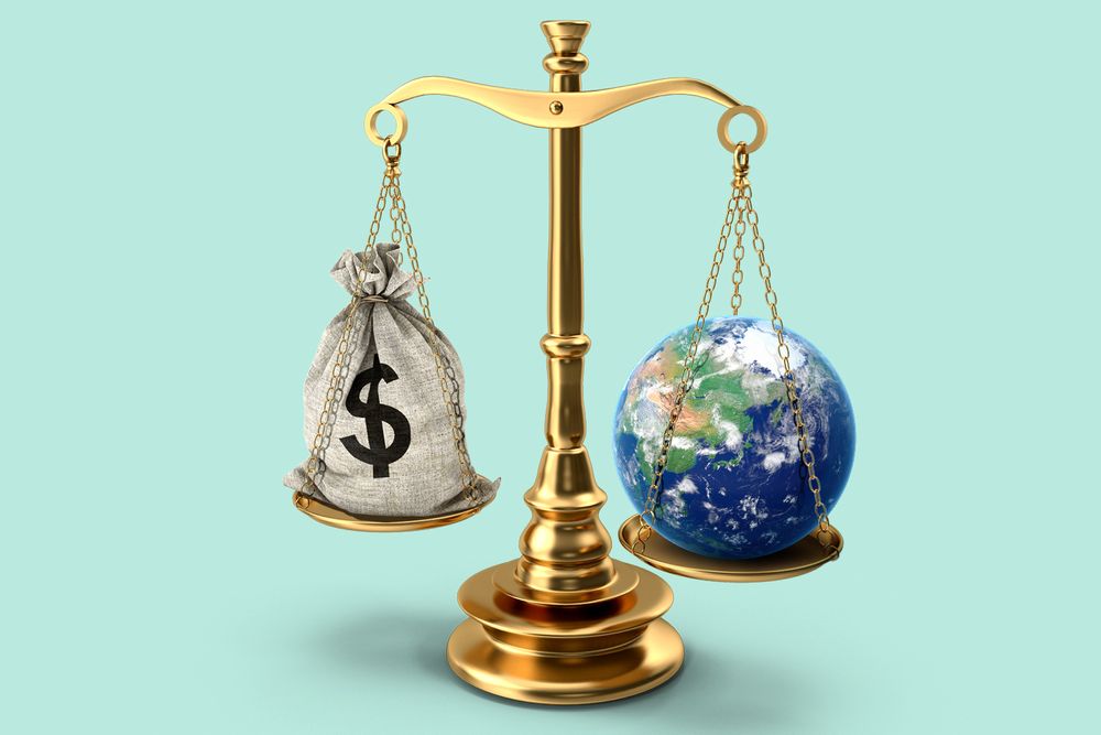 A scale with a bag of money on one side and a globe on the other.