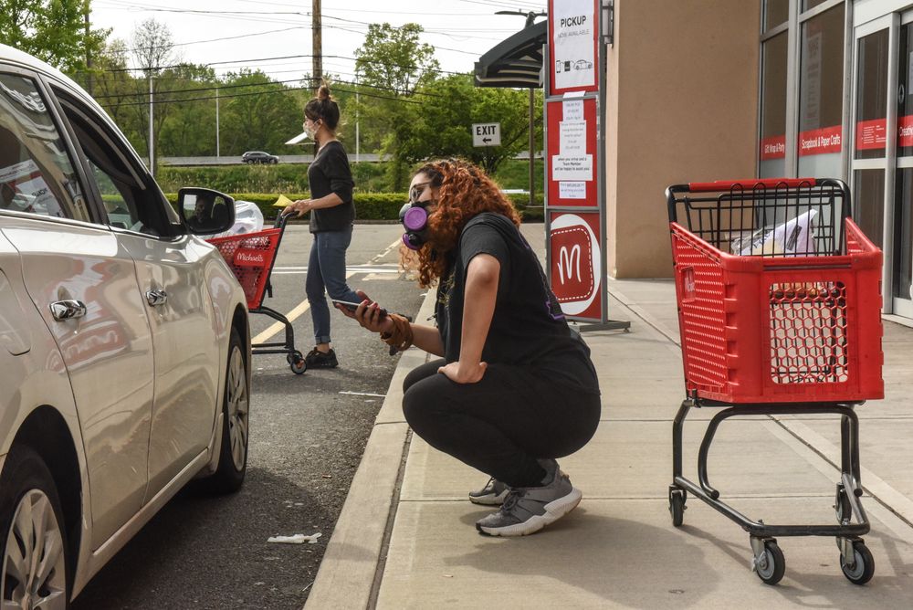 PARAMUS, NJ - MAY 18: An employee of Michaels retail store delivers an o...