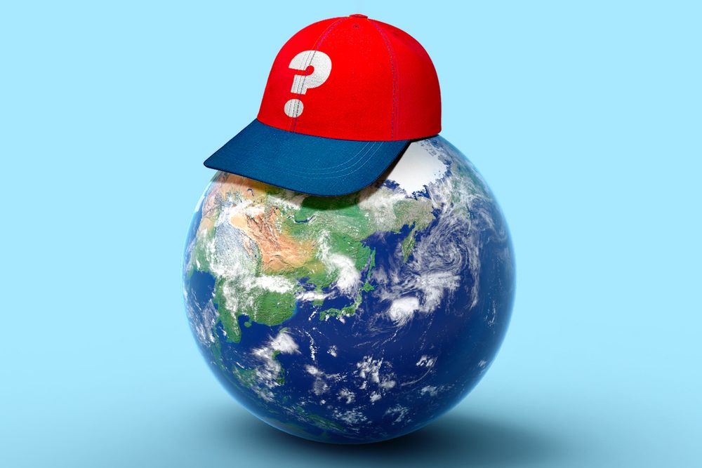 hat with question mark sitting on top of the earth