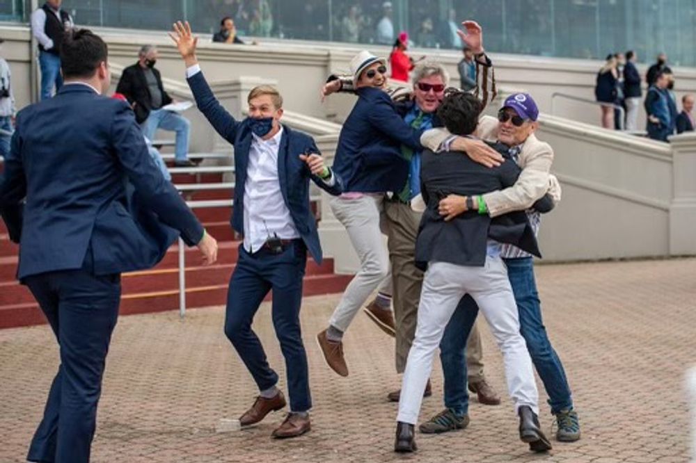 Six men celebrating their horses win and heading to the Kentucky Derby