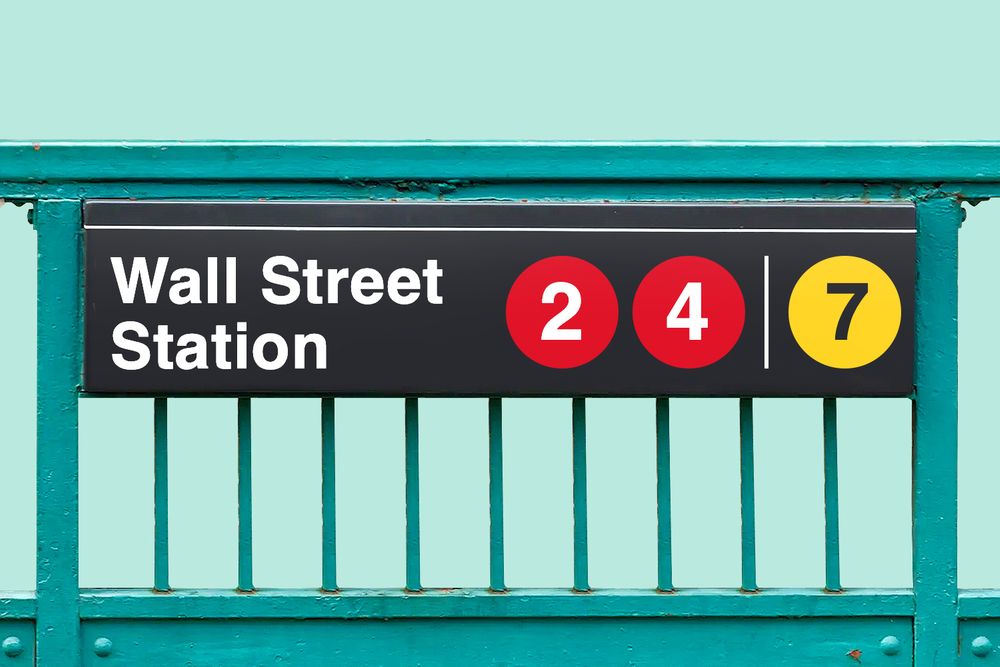 Subway station sign that reads "Wall Street Station 24/7"