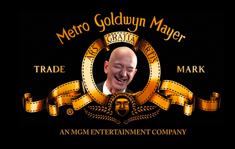 An illustration of the gold MGM crest and name in front of a black background. Instead of a roaring lion in the middle, Jeff Bezos's head is pictured scrunched up and laughing. 