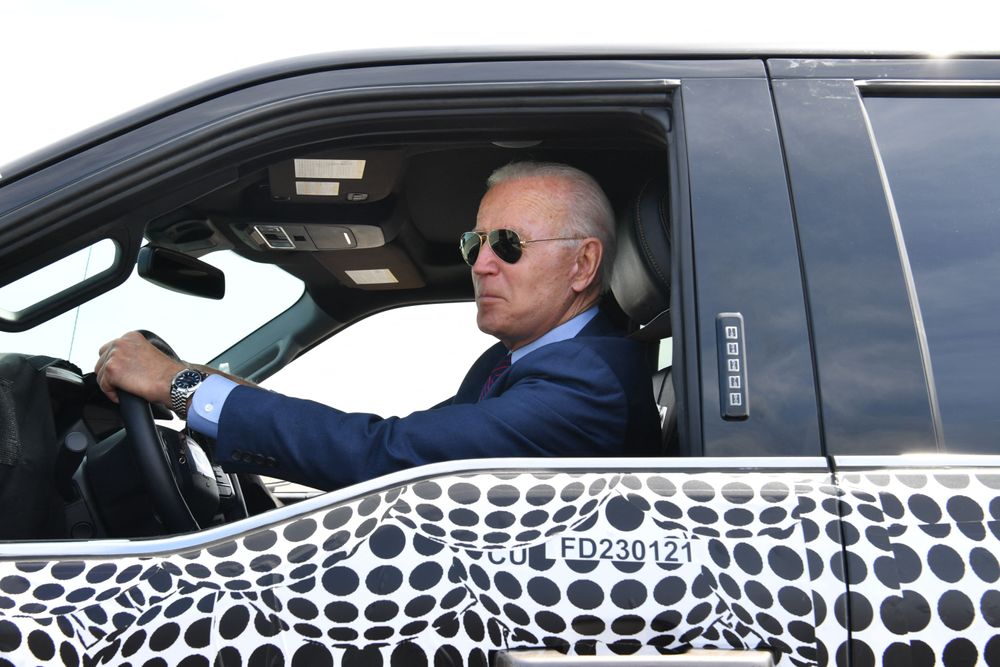 US President Joe Biden drives the new electric Ford F-150 Lightning at t...