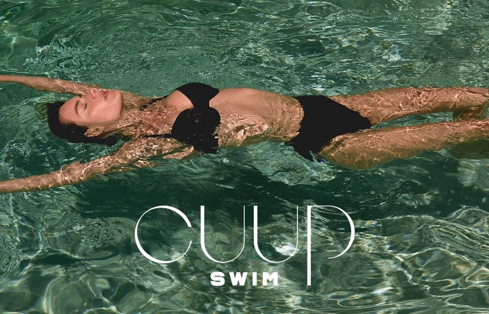 Woman in a pool wearing Cuup swimwear