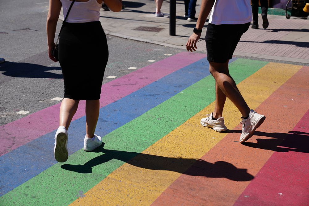 LONDON,UNITED KINGDOM - JUNE 01: People walking over a rainbow crossing ...