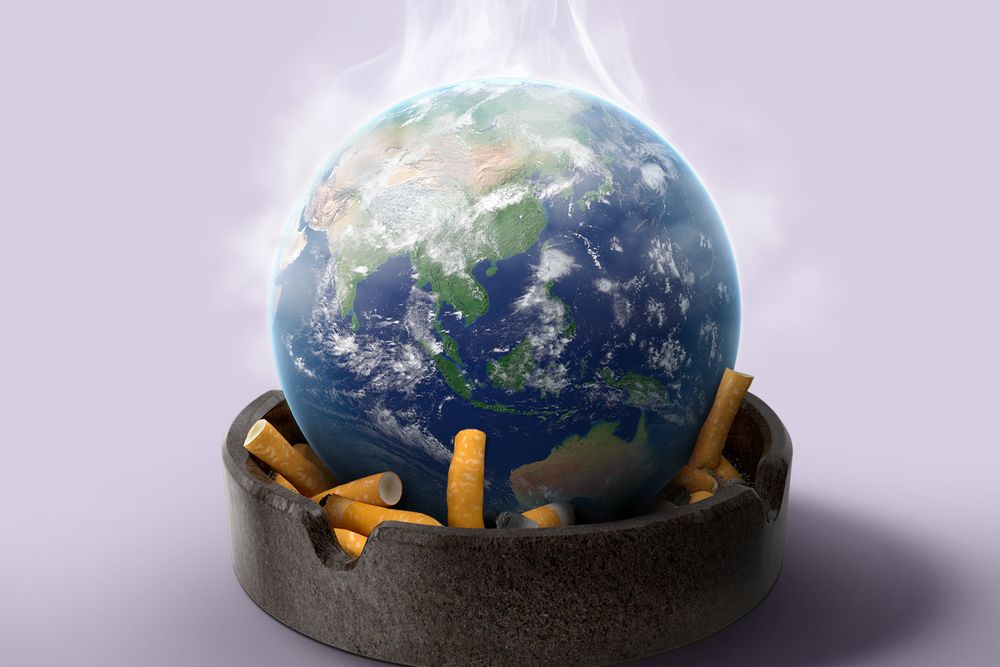 An illustration of the planet Earth sitting on top of crumpled cigarettes in a grey ashtray. Smoke fumes are rising off the top of the Earth.