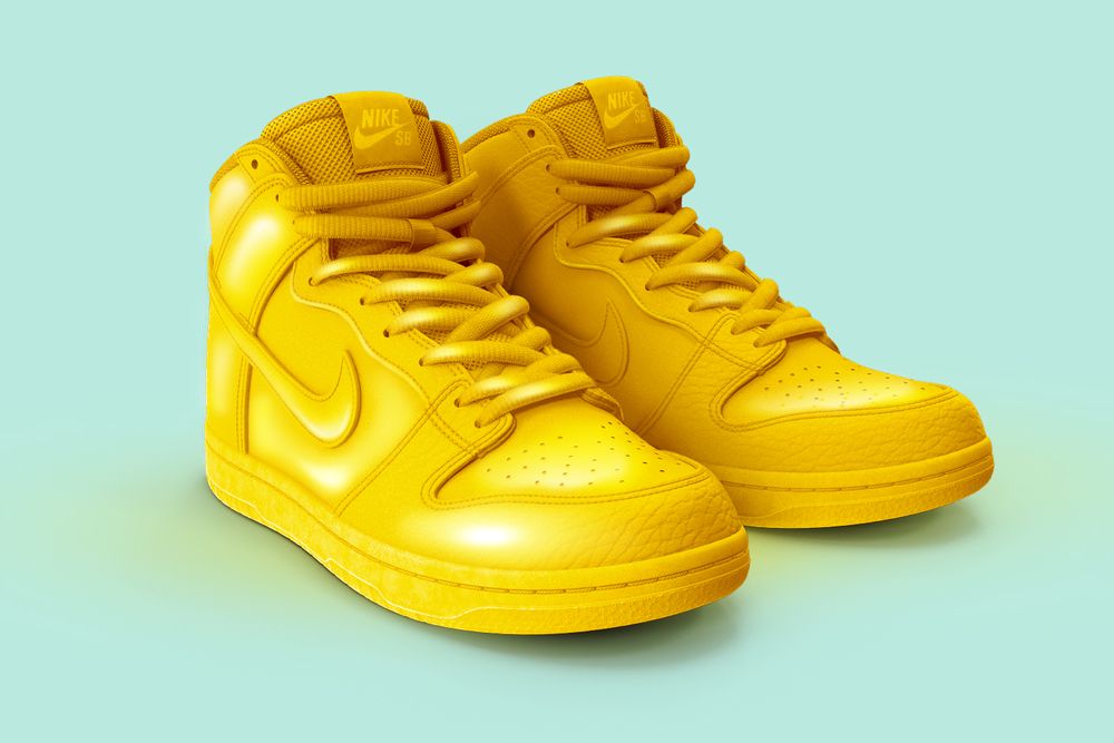 A pair of golden Nike sneakers