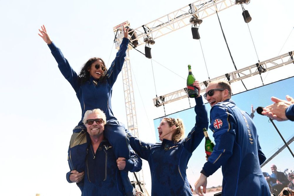 Branson and crew celebrating the completion of a space flight 