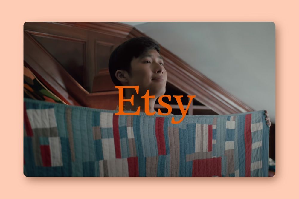 image from an Etsy campaign that shows a boy holding up a quilt