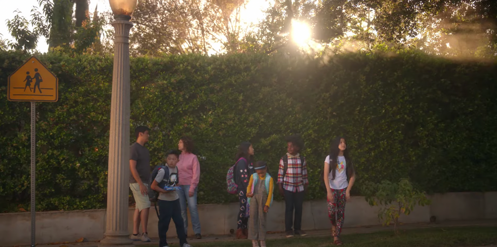 Walmart ad showing kids at a bus stop