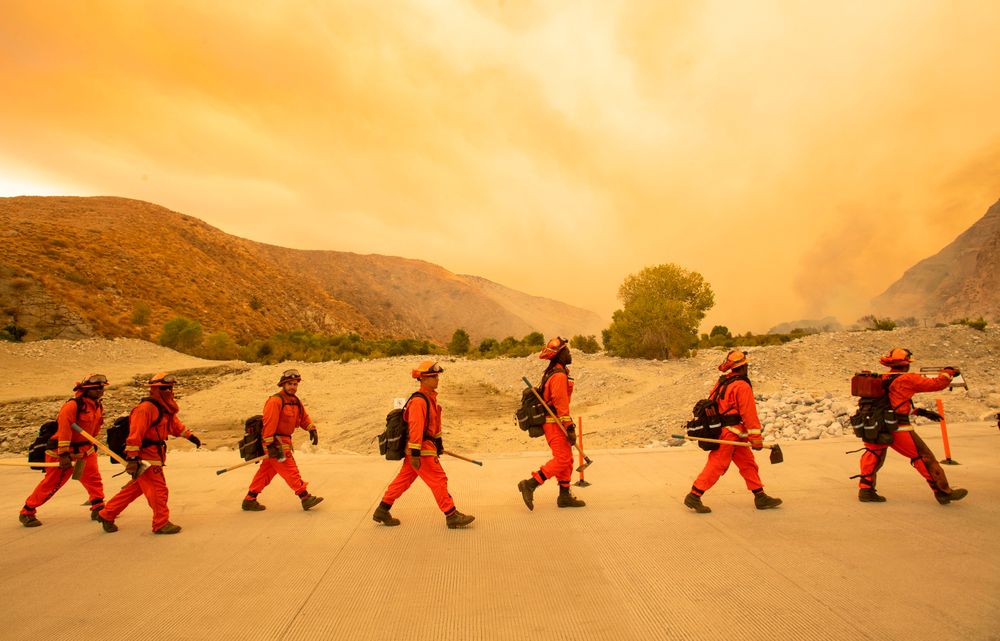 TOPSHOT - Inmate firefighters arrive at the scene of the Water fire, a n...