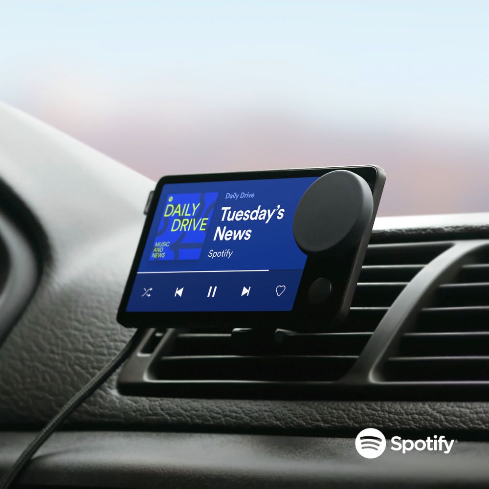 Spotify's Car thing clipped to a car's air conditioning vent