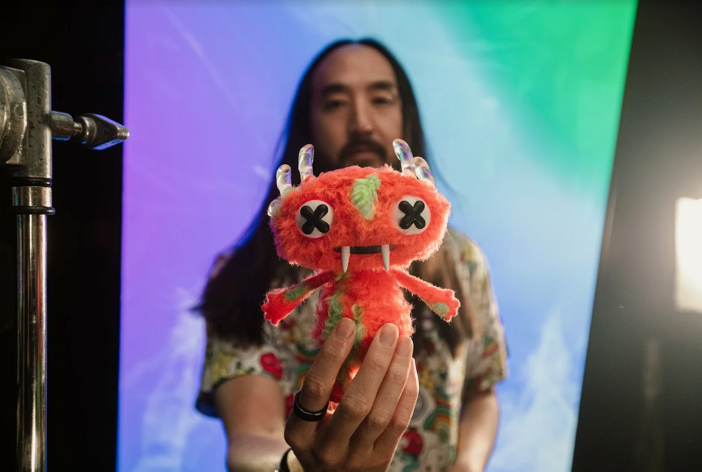 Steve Aoki holding Character X, the avatar featured in the DJ's new NFT series