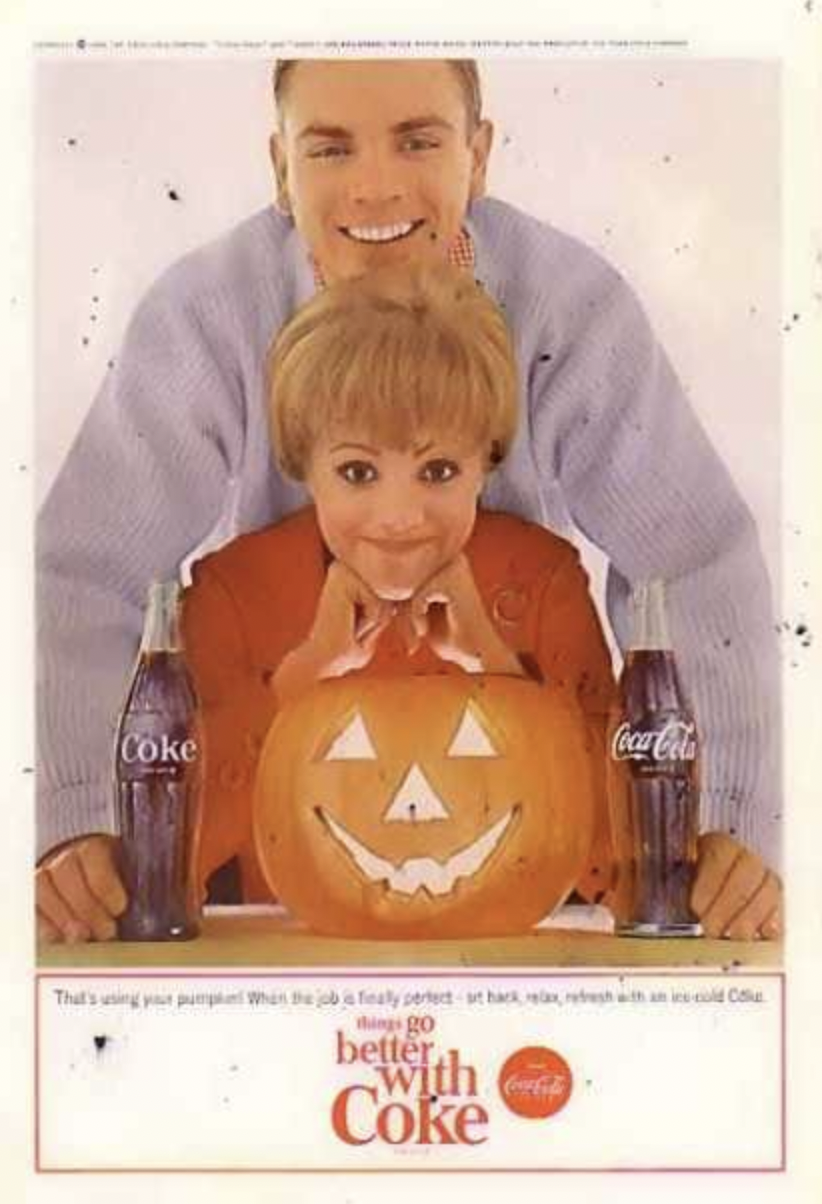 vintage Coke ad showing a woman and man with a pumpkin