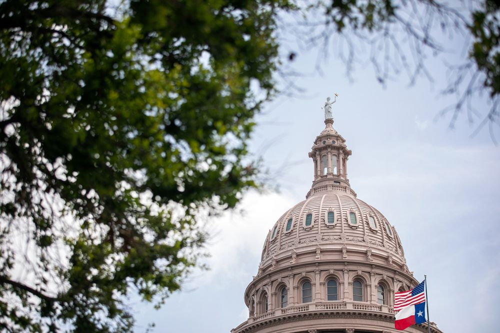 AUSTIN, TX - JULY 13: The U.S. and Texas flags wave outside the Texas Ca...