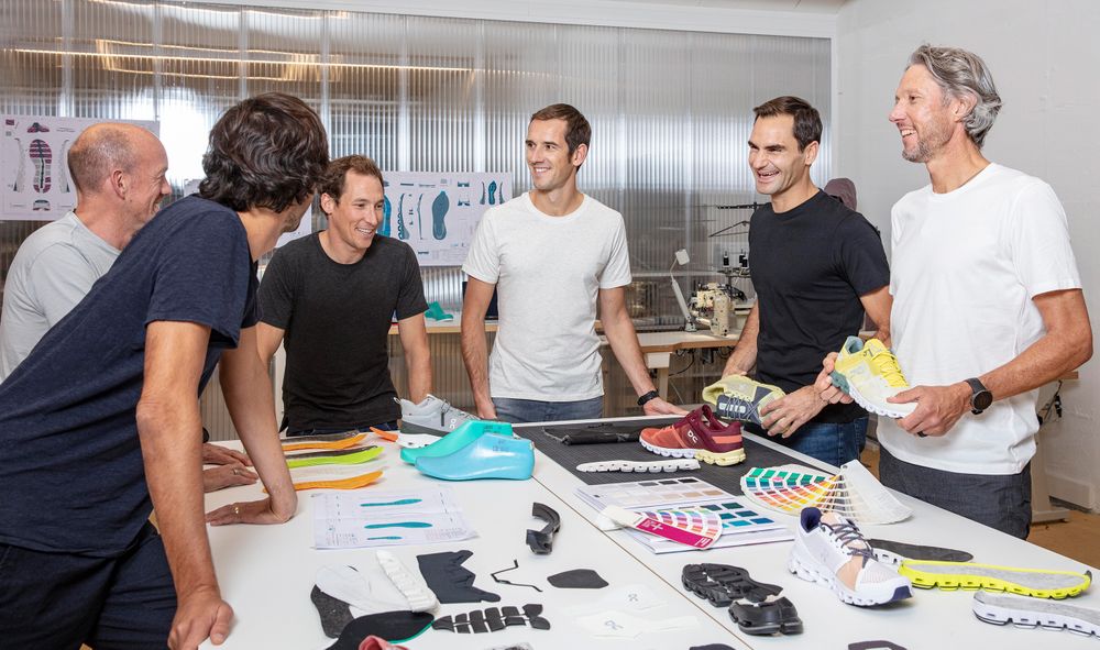 A photo of Roger Federer with the On team 