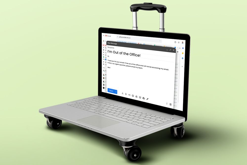 Out of office message on laptop with wheels and handle like a suitcase