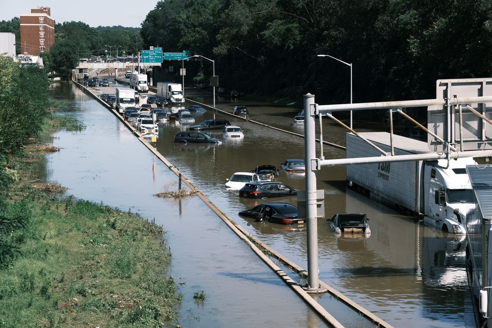 NEW YORK CITY - SEPTEMBER 02: Cars sit abandoned on the flooded Major De...