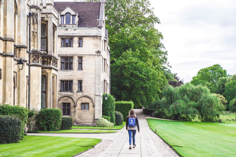 Woman walks on a college campus