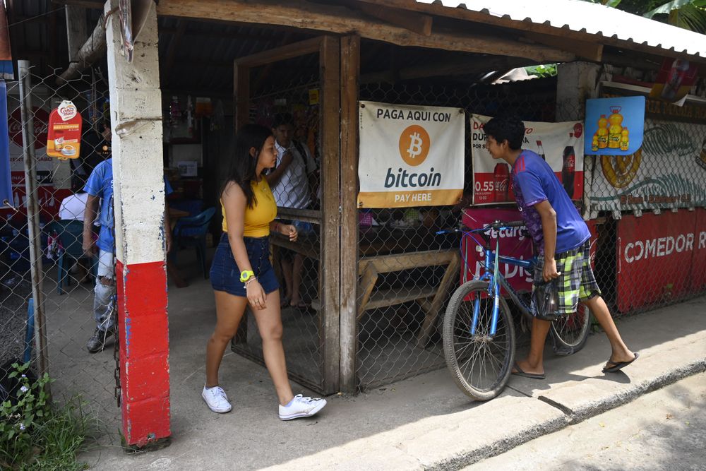 People are seen in a store where bitcoins are accepted in El Zonte, La L...