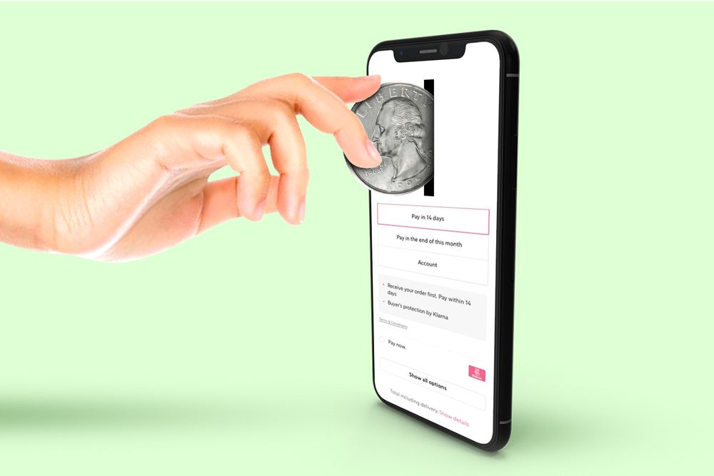 A phone showing a hand making an installment payment