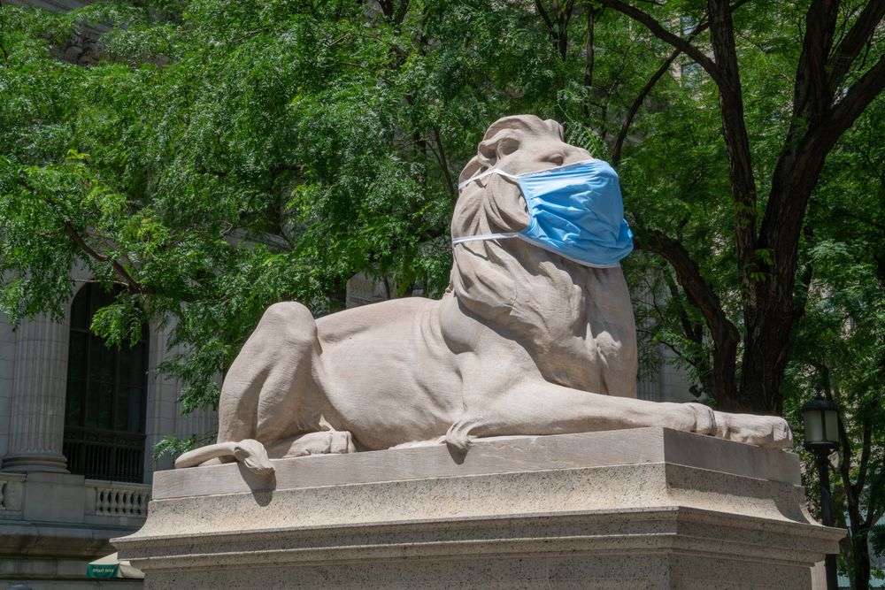 NYPL lion wearing a mask