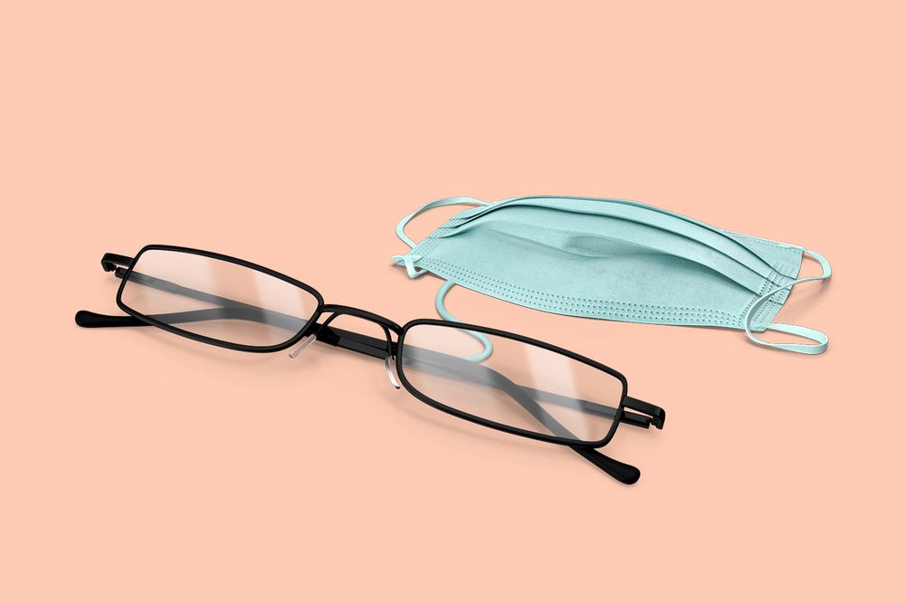 Warby Parker glasses next to a medical mask