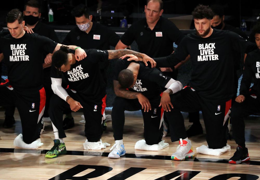 NBA players kneeling