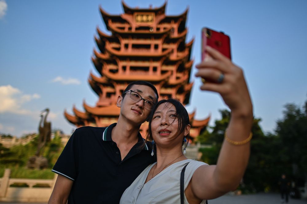 Tourists take a selfie at the the Yellow Crane Tower in Wuhan, China's c...