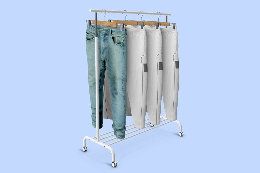 Closet rack with one pair of jeans and several sweats