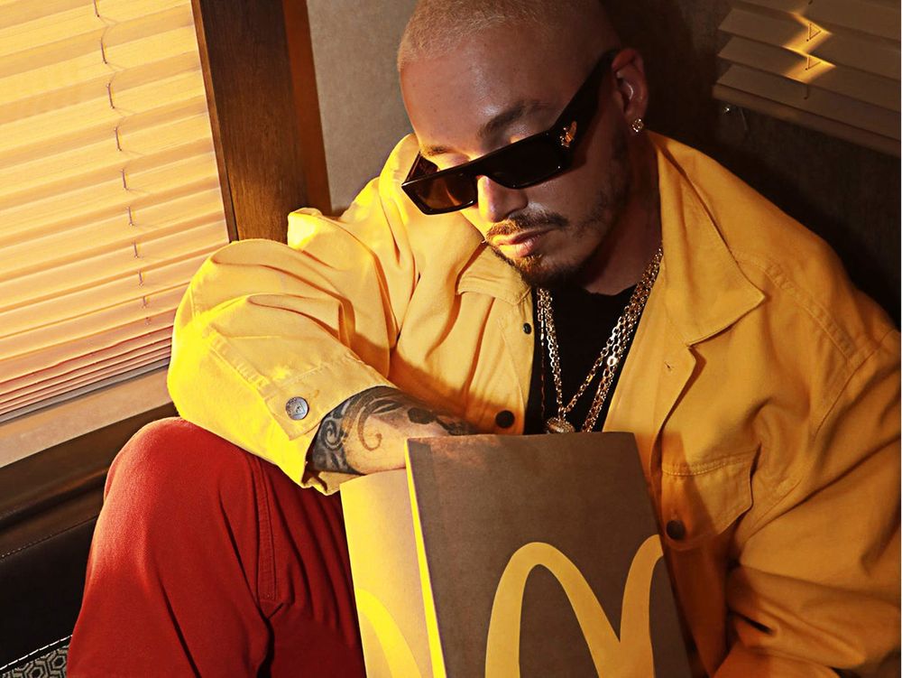 Singer J Blavin with his hand in a McDonald's bag 