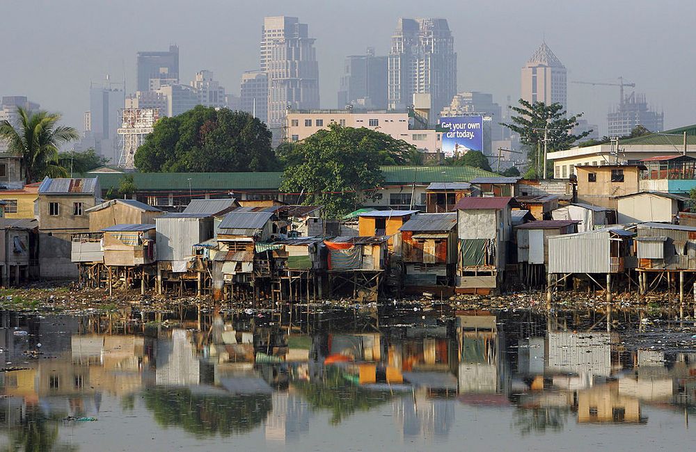 An image of shacks on the water 