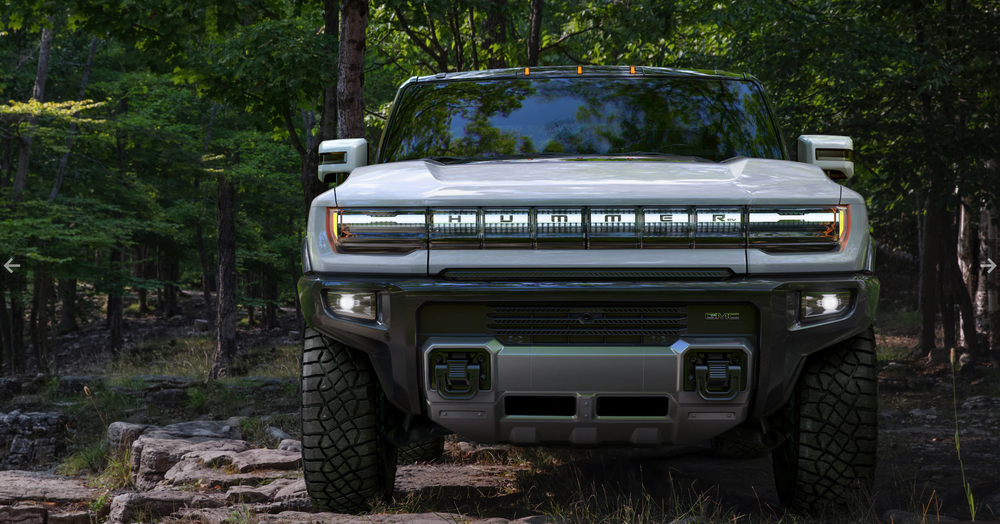 A rendering of GMC's Hummer EV in a forest