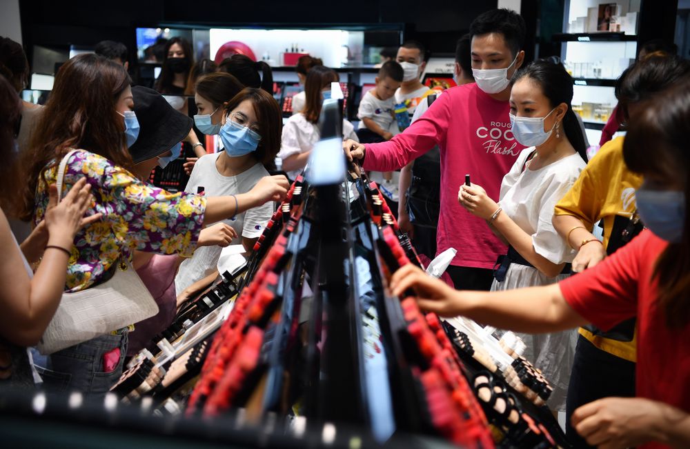 Tourists shop at a duty-free shopping mall in Sanya City, south China's Hainan Province.