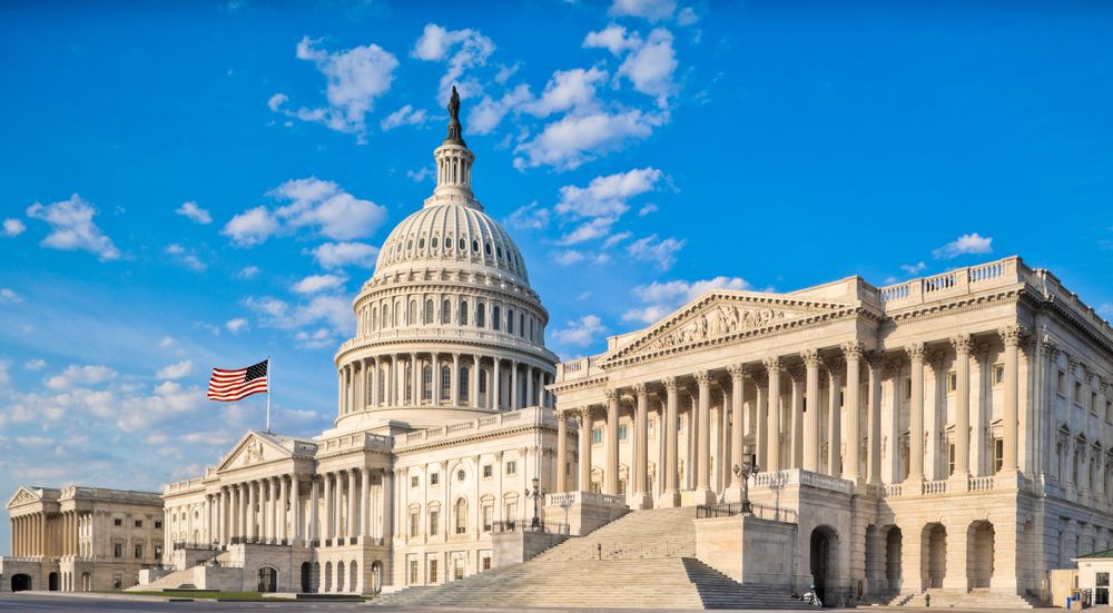 A photo of the Capitol building under a blue sky.