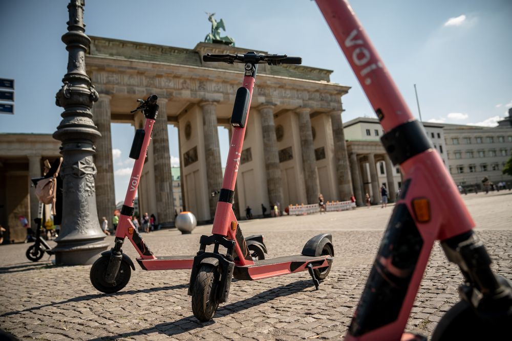 17 August 2020, Berlin: Electric scooters of the rental provider voi. ar...