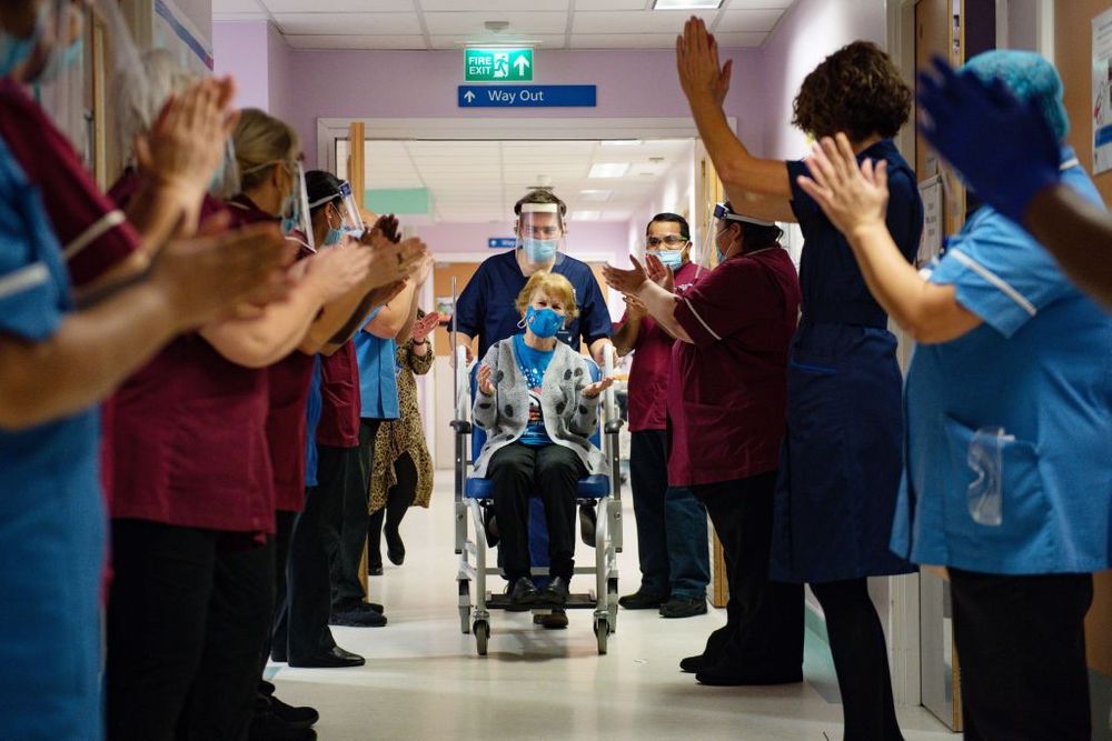 Woman being greeted for getting a vaccine 