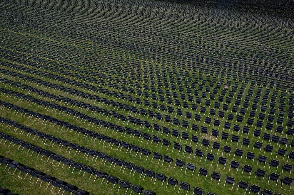 Twenty thousand chairs, each representing 1,000 deaths from the coronavirus pandemic in the United States are lined up on the Ellipse for the first National COVID-19 Remembrance October 04, 2020 in Washington, DC. 